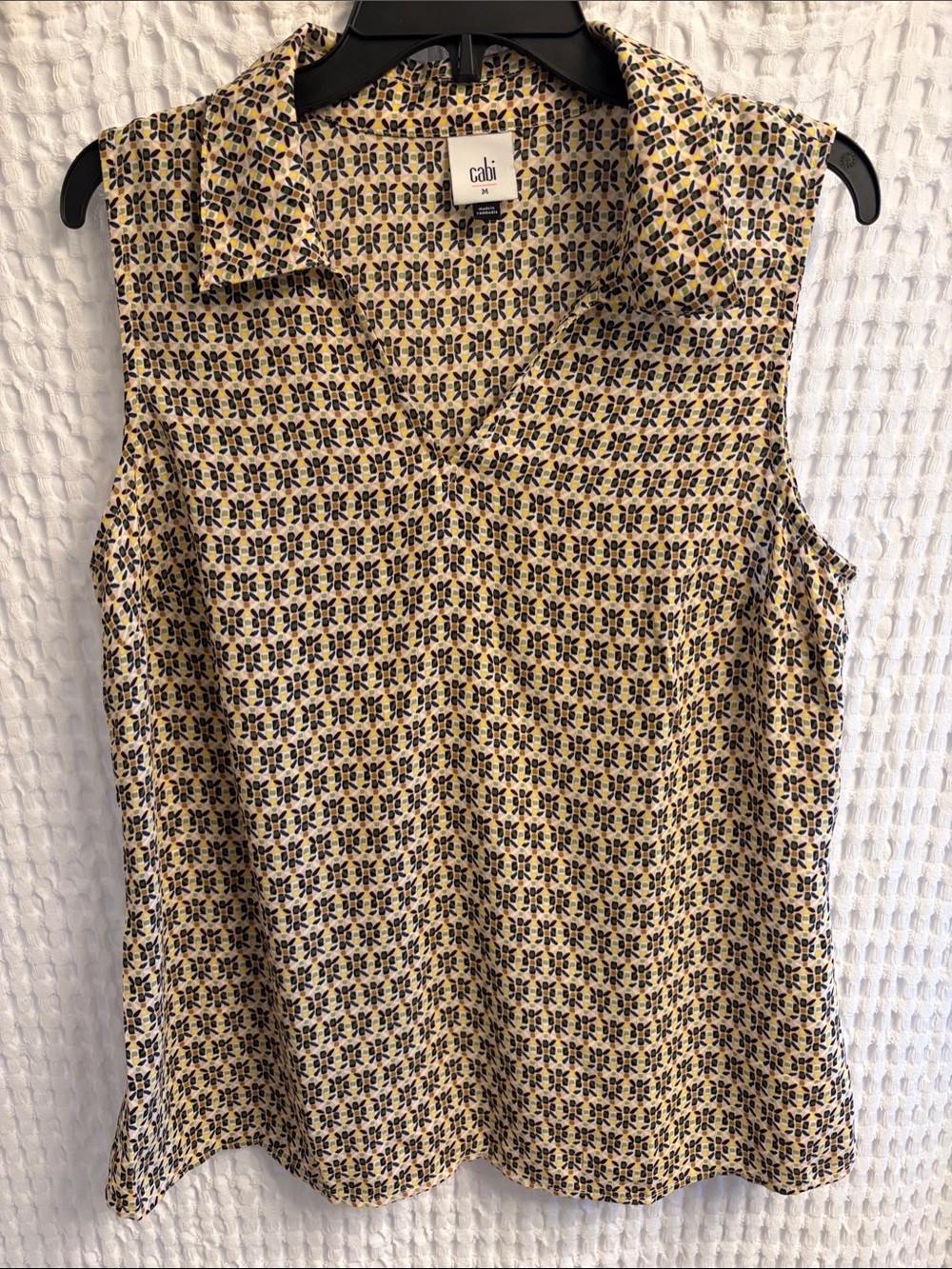 CAbi Sleeveless Collared Printed Top in cream, black, green, yellow print